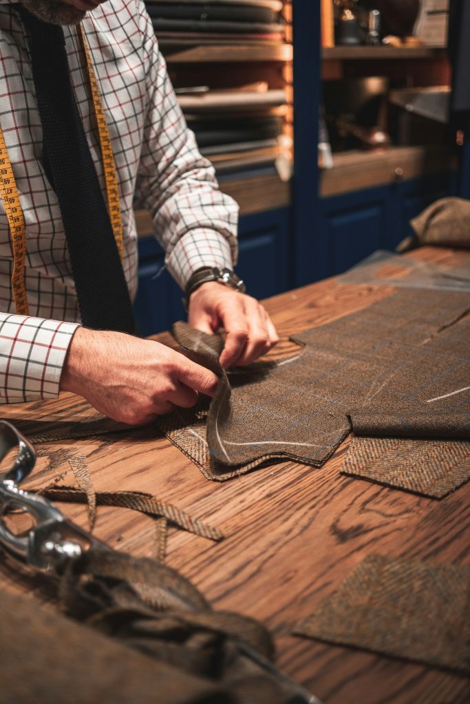 Bespoke Tailoring in Nairobi: What to Expect When Your Clothes Are Made Exclusively for You nairobi tailor drafting a bespoke suit pattern in Nairobi